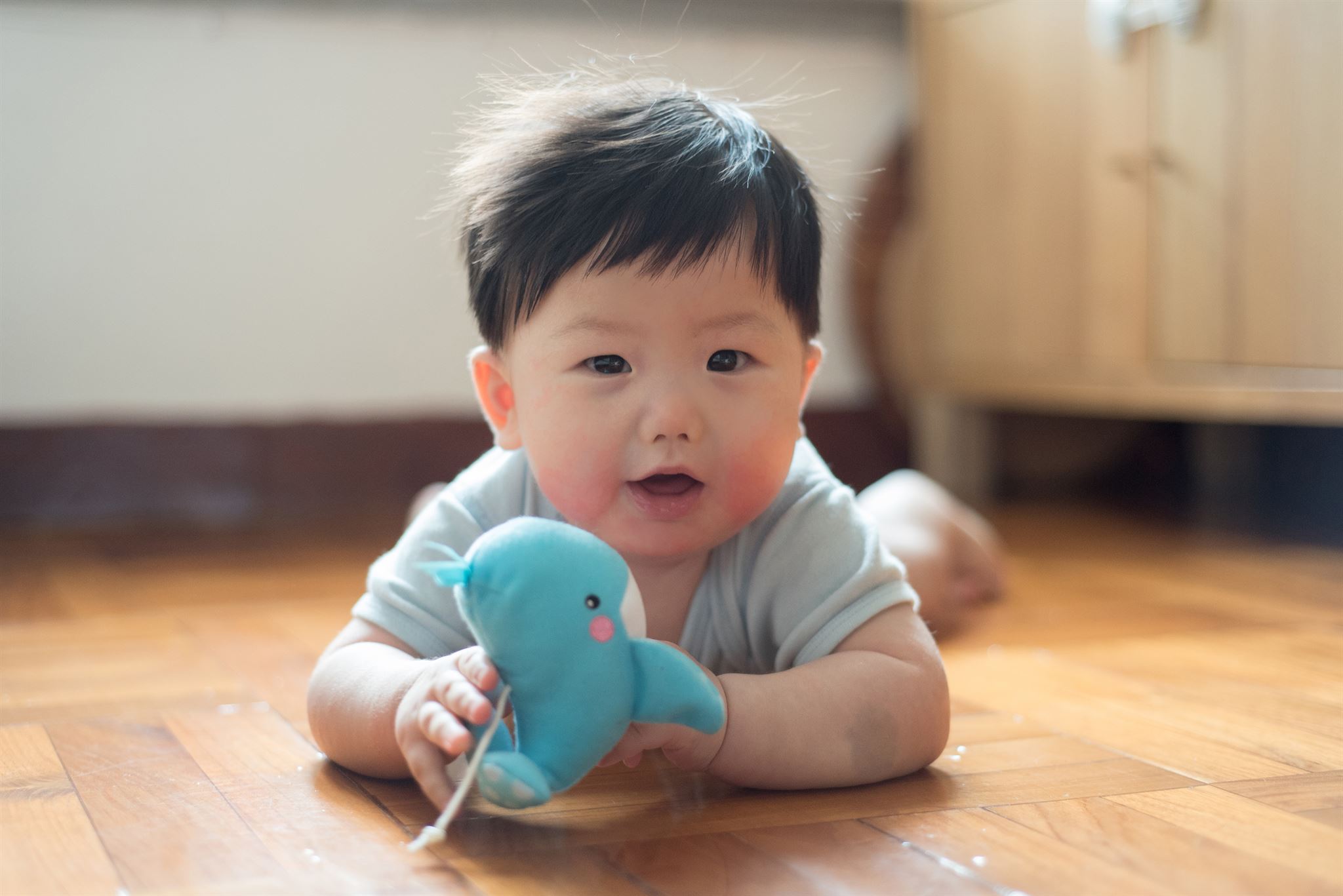 Boy-playing-with-stuffed-toy